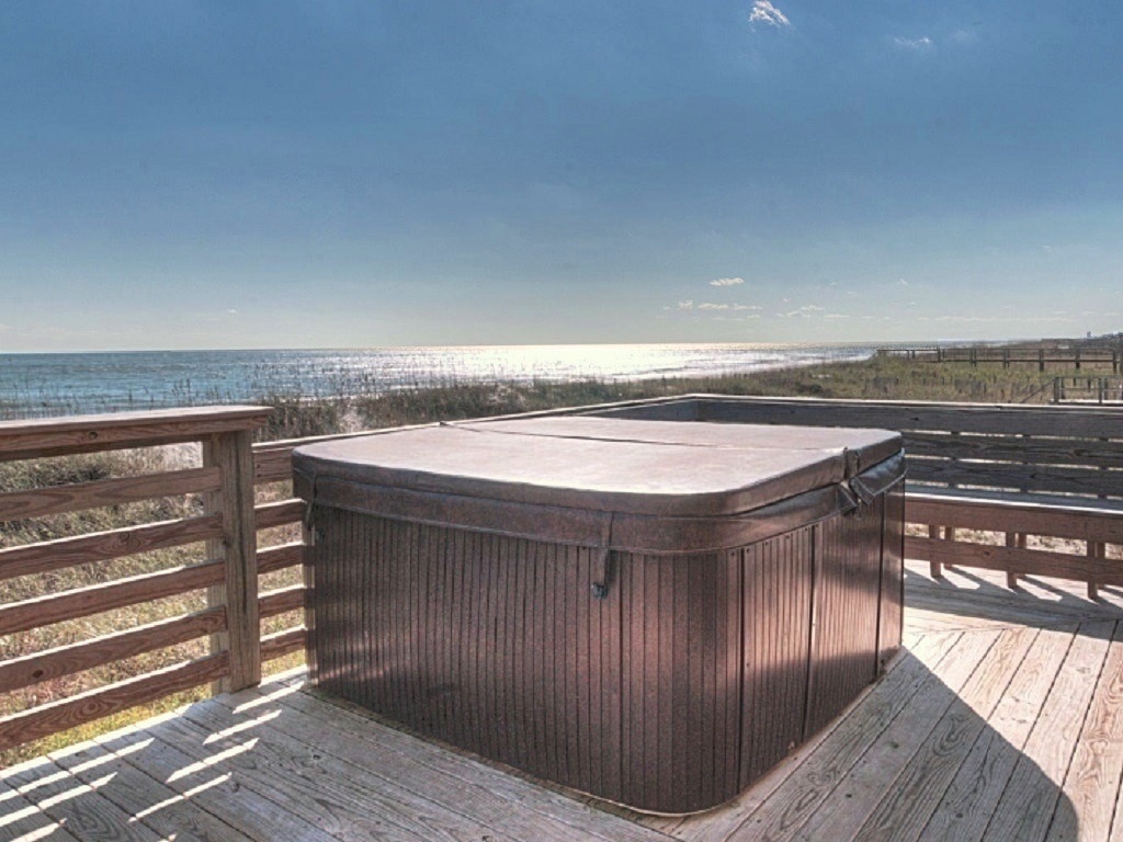 Hot Tub Deck overlooks the ocean. Bench seating and raised bar seating.