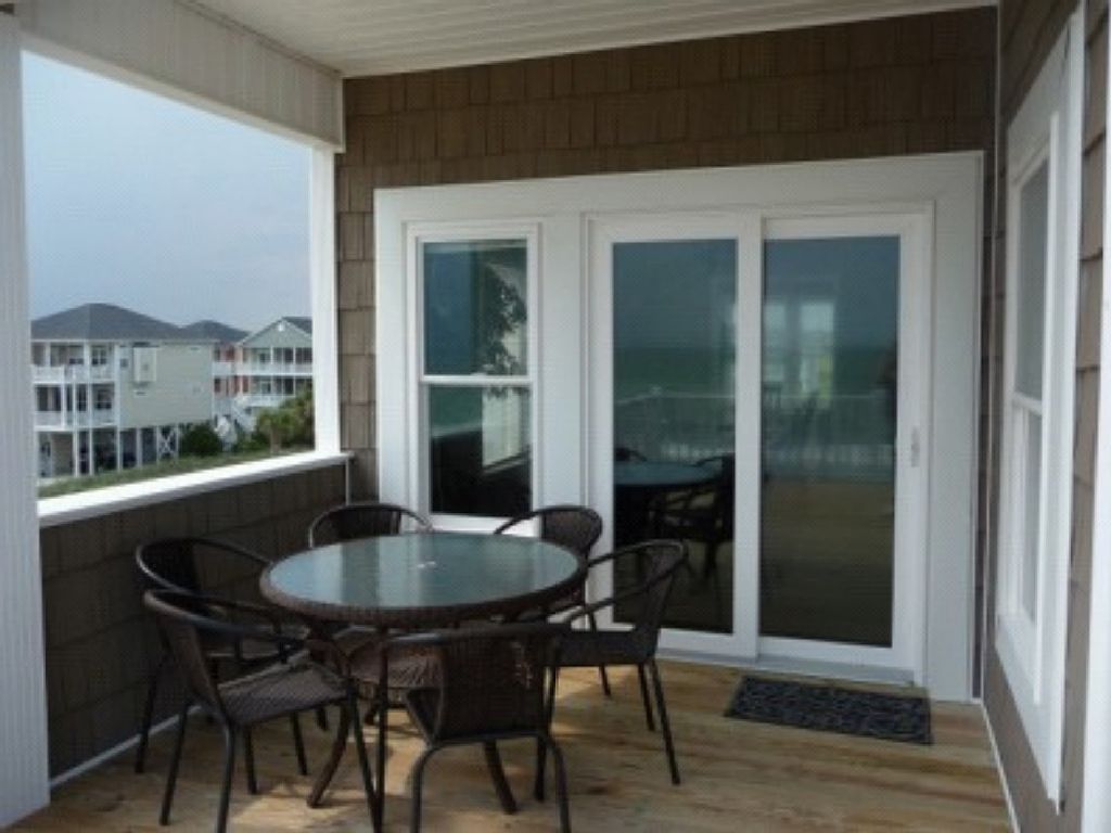 Covered porch - seats 6 - open to oceanfront upper deck, goes in to dining room